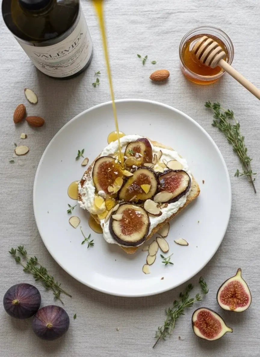 Sourdough tartine with ricotta and sliced figs, finished with extra virgin olive oil