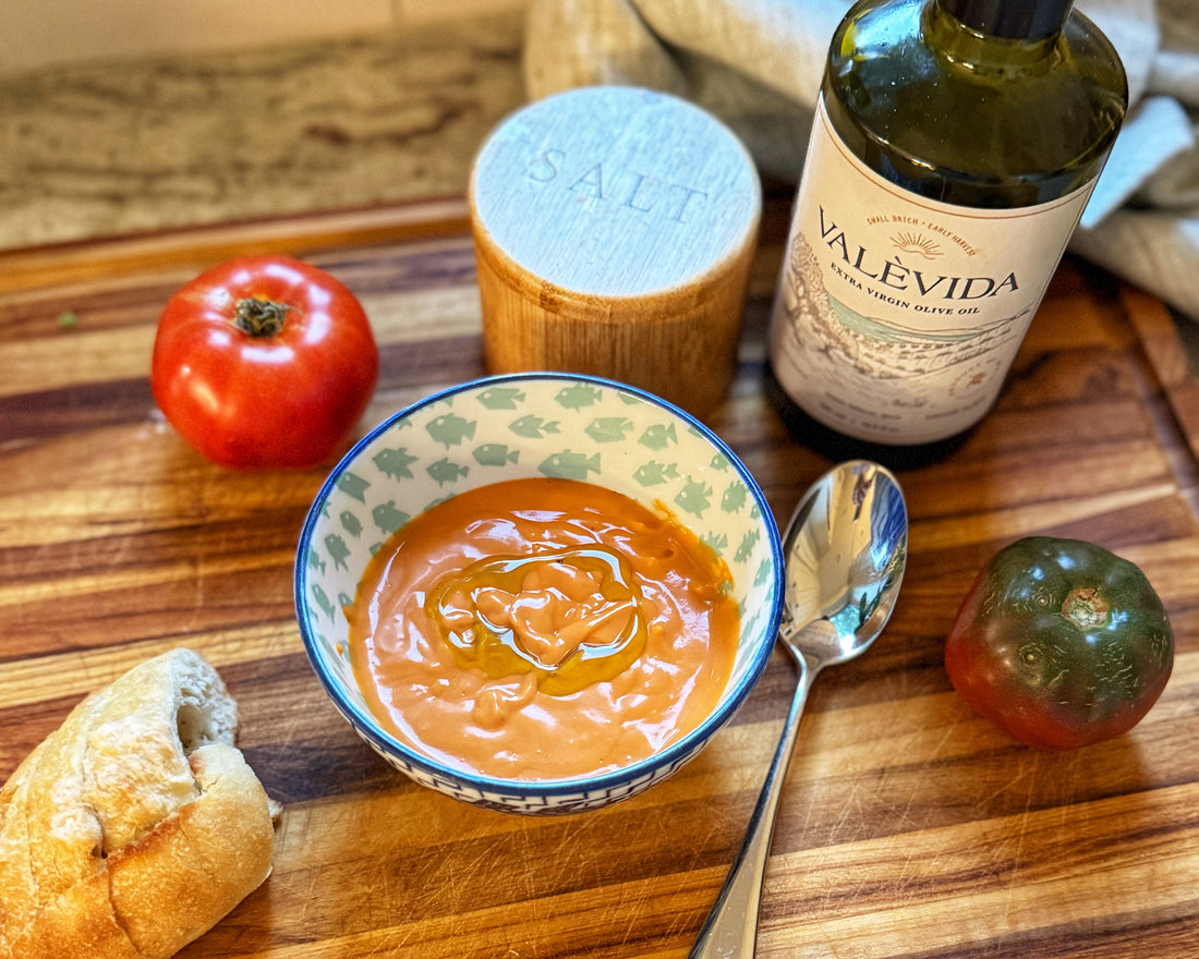 Salmorejo poured into a bowl with a swirl of Valèvida extra virgin olive oil