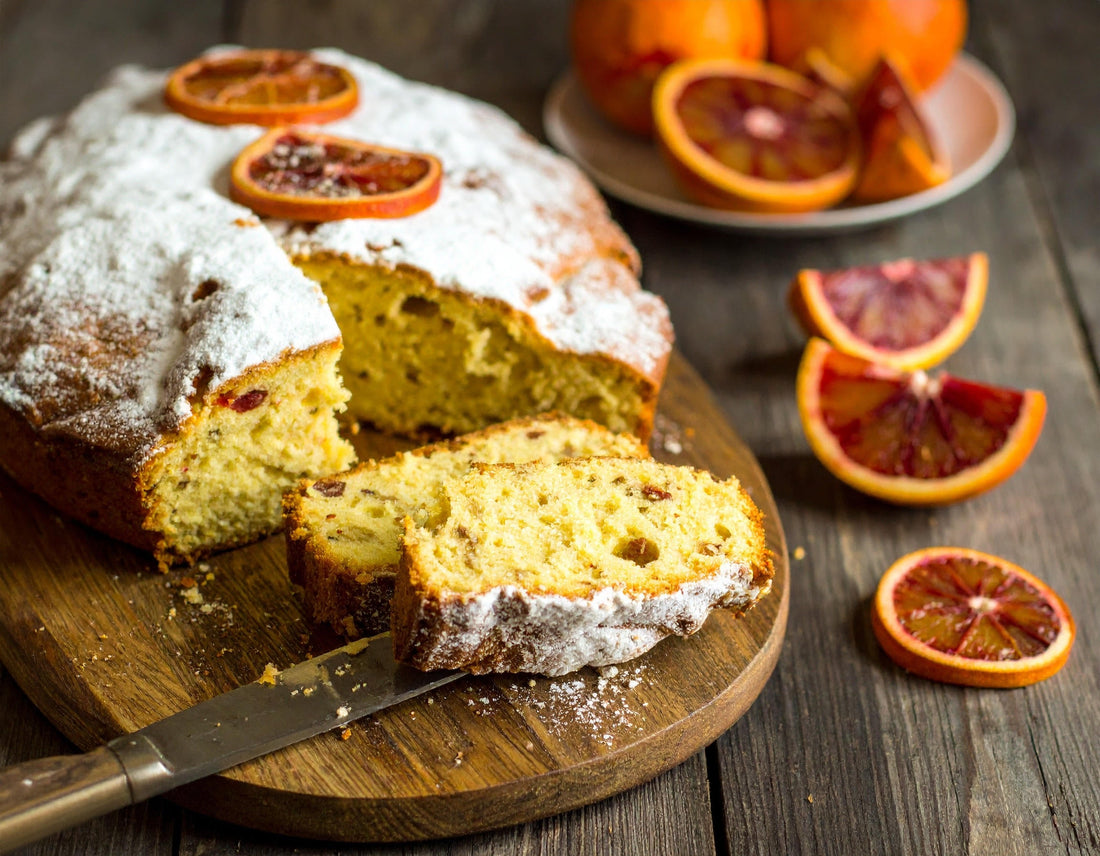 Sliced blood orange olive oil cake showing a tender, moist crumb